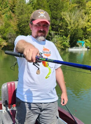 vexan 8' 6" inshore spinning rod for musky held up by Cory Allen