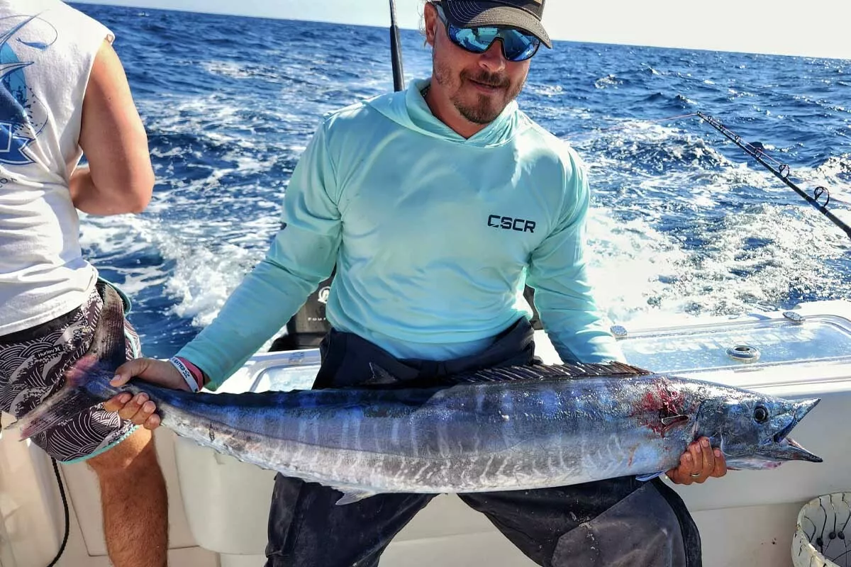 Mike Dupree holds a chunky wahoo caught slow trolling ballyhoo on North Carolina