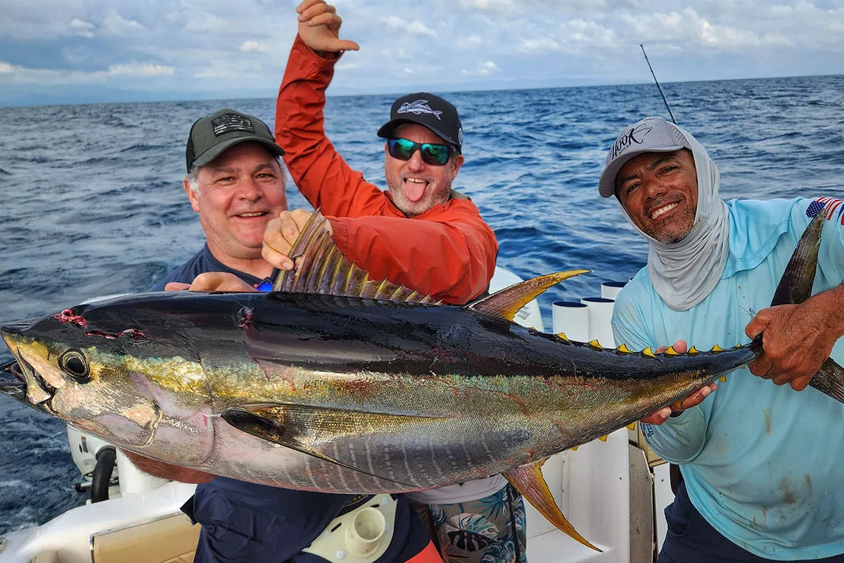 Mike Hennessy and crew with a nice yellowfin tuna caught fishing with In The Spread in Costa RIca