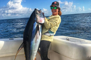 female angler Chumming for Tuna