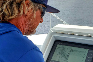 Kevin Hibbard showing Blue Marlin Fishing boat driving