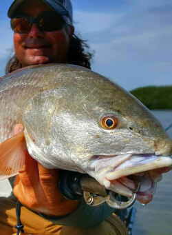 Captain William Toney with a nice redfish caught on a gold spoon