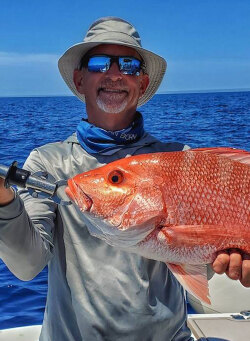 Capt. William Toney with a fat Homosassa, Florida gag grouper caught reef fishing
