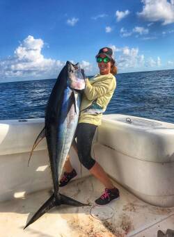 female angler Chumming for Tuna