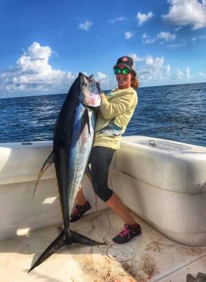 female angler Chumming for Tuna