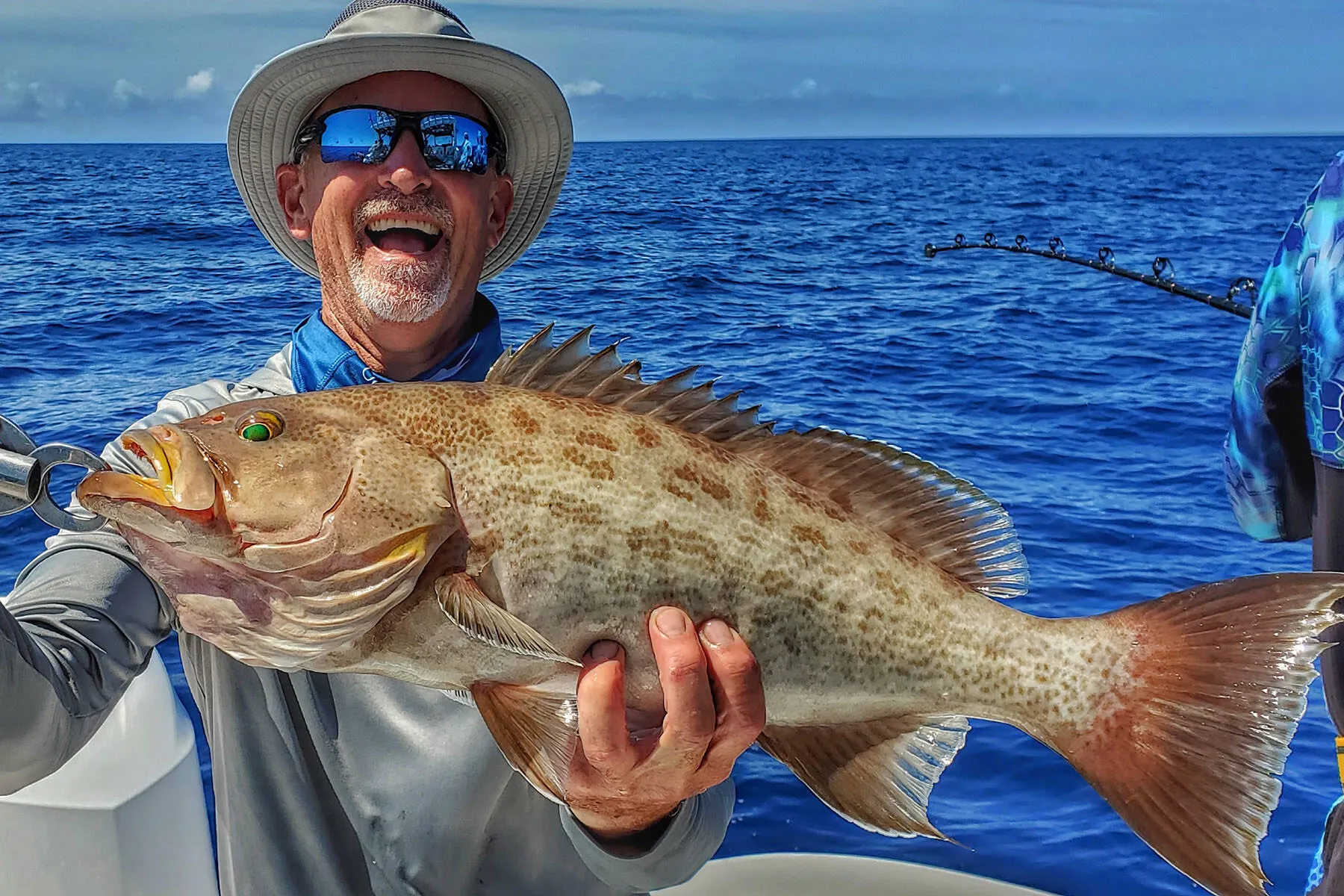 kevin adney with a Florida gag grouper caught bottom fishing