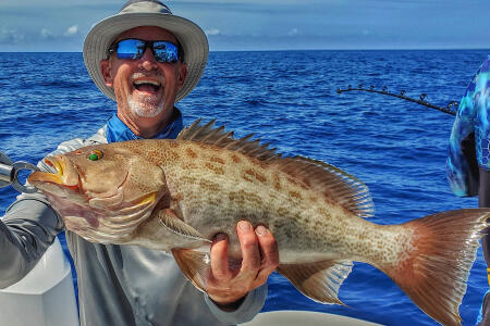 kevin adney with a Florida gag grouper caught bottom fishing