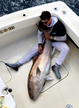 Chad Raney and his mate lift a huge amberjack caught wreck fishing south Florida