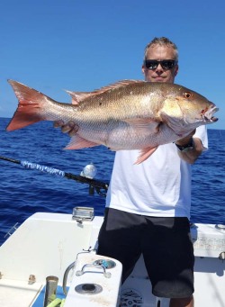 Seth Horne holding a 30 inch mutton snapper caught with good karma sportfishing