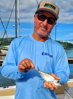 Mike Hennessy shows hook placement to swimming live baits