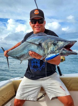 seth horne from in the spread with a big wahoo caught on a stickbait from all or nothing lures