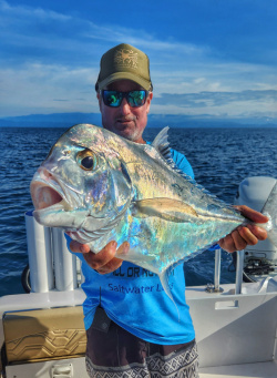 Mike Hennessy with a African pompano caught bottom fishing in Costa Rica