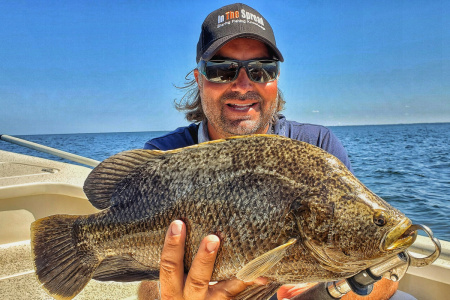 Florida inshore fishing guide William Toney holds a tripletail fish