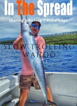 Shawn Rotella holding a wahoo caught slow trolling live bait in Hawaii