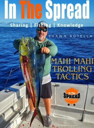 Captain Shawn Rotella of Kona Hawaii holds a dolphin caught trolling