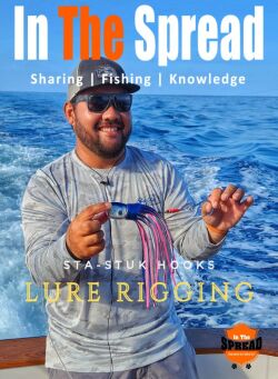 Kris Ishibashi holding a blue marlin lure rigged with Sta-Stuk hook